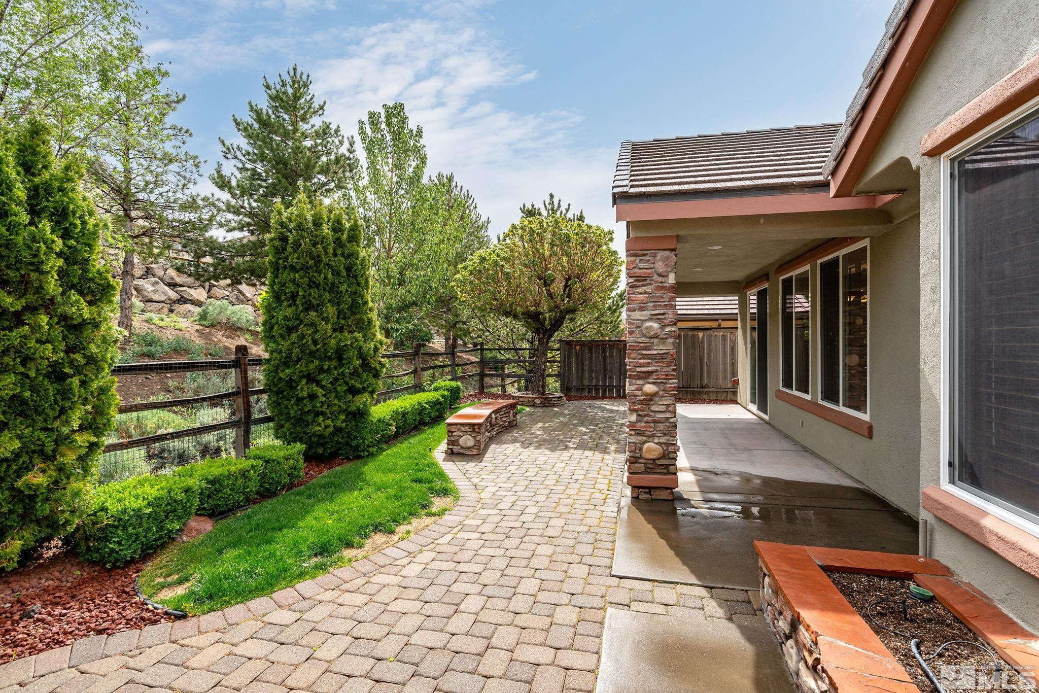 1280 Meridian Ranch Drive Reno, NV 89523 - Photo 29 of 41 a view of a patio with table and chairs and potted plants
