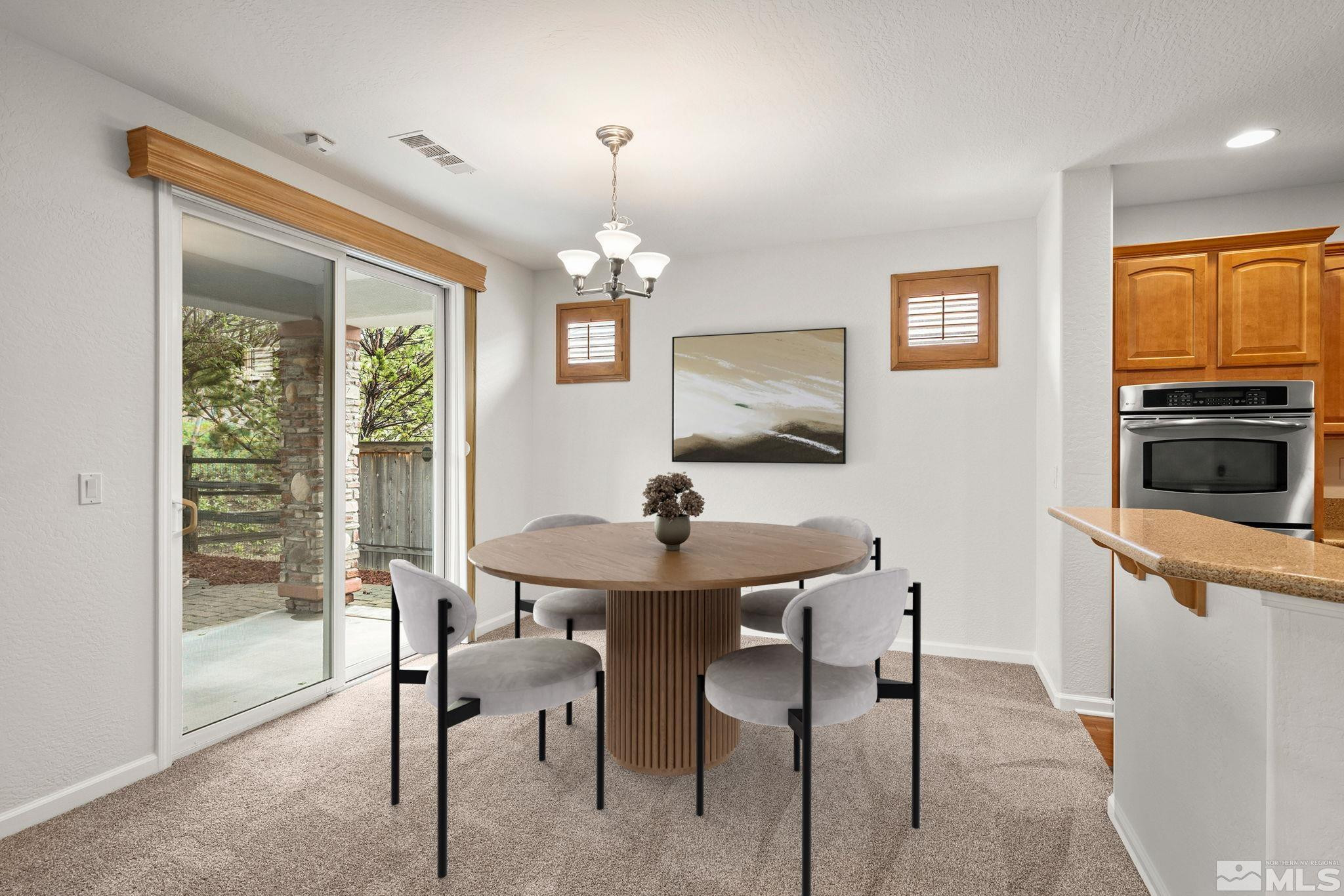 1280 Meridian Ranch Drive Reno, NV 89523 - Photo 5 of 41 a view of a dining room with furniture window and outside view