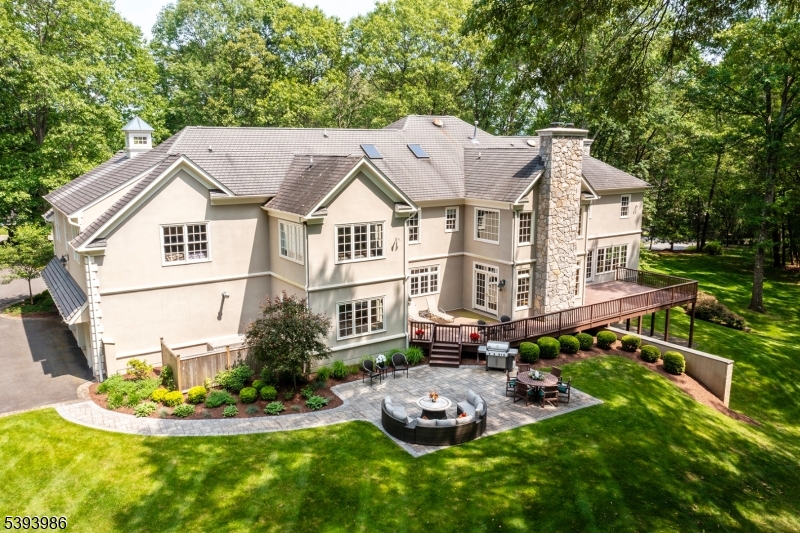 a aerial view of a house with swimming pool and garden
