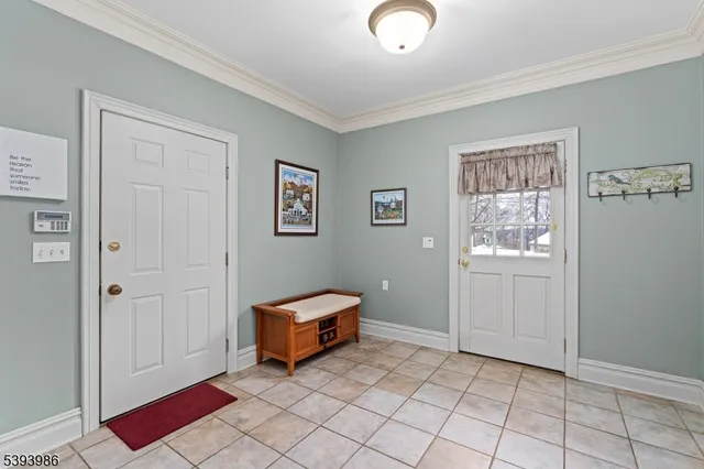 a spacious bedroom with a bed and a window