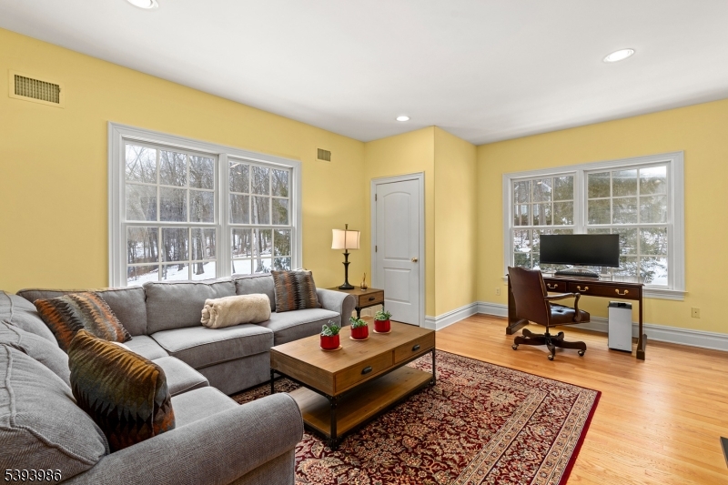 7 Timber Ridge Road Far Hills, NJ 07931 - Photo 33 of 49 a living room with furniture and a flat screen tv