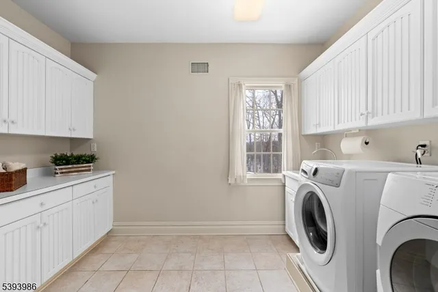 a utility room with closet dryer and washer