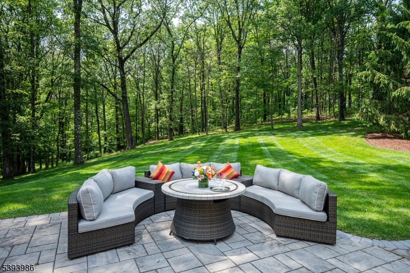 7 Timber Ridge Road Far Hills, NJ 07931 - Photo 46 of 49 a view of a patio with couches fire pit and a big yard