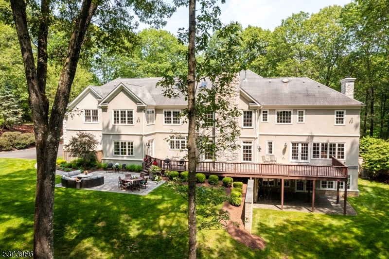 7 Timber Ridge Road Far Hills, NJ 07931 - Photo 48 of 49 a front view of a house with a yard table and chairs