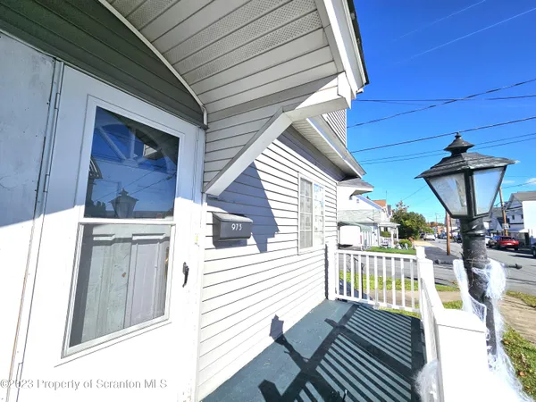 a view of a balcony with chairs