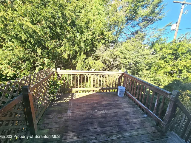 a view of balcony with wooden floor