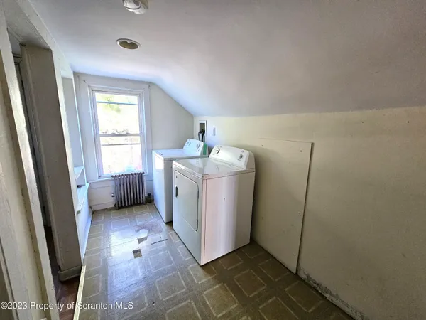 a utility room with dryer and washer