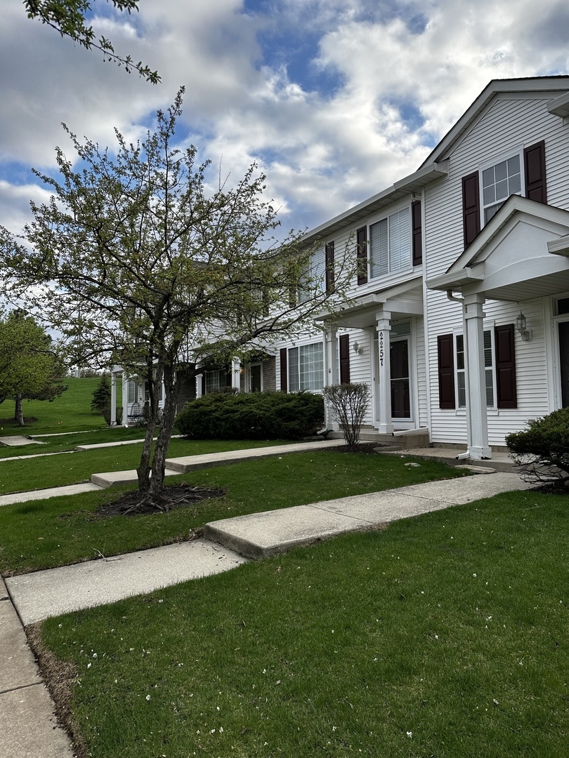 2255 Reflections Drive Aurora, IL 60502 - Photo 2 of 20 a front view of a house with a yard