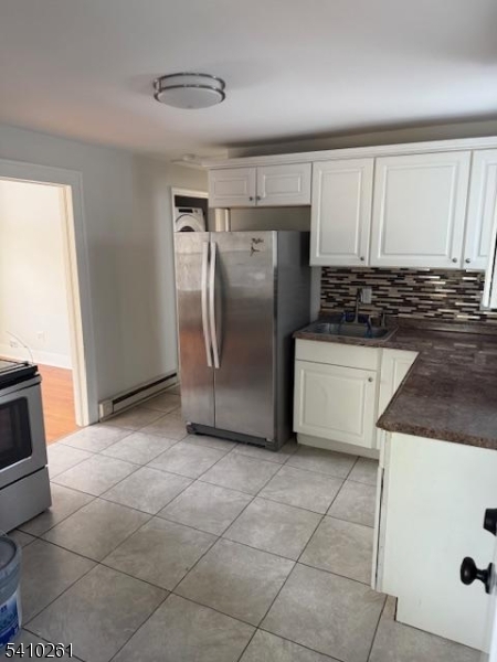 25 Flanders Road Netcong, NJ 07857 - Photo 1 of 14 a kitchen with granite countertop a refrigerator and a stove top oven