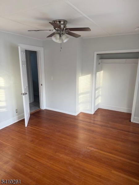 25 Flanders Road Netcong, NJ 07857 - Photo 11 of 14 a view of empty room with wooden floor and fan