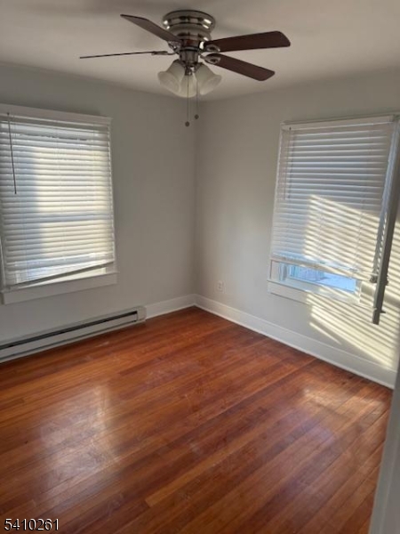 25 Flanders Road Netcong, NJ 07857 - Photo 12 of 14 an empty room with wooden floor fan and windows