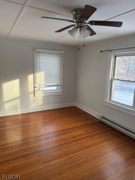 25 Flanders Road Netcong, NJ 07857 - Photo 2 of 14 an empty room with wooden floor and windows