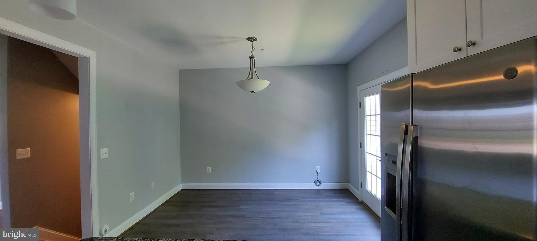 1056 Rye Drive La Plata, MD 20646 - Photo 15 of 23 a view of an empty room with wooden floor and a window