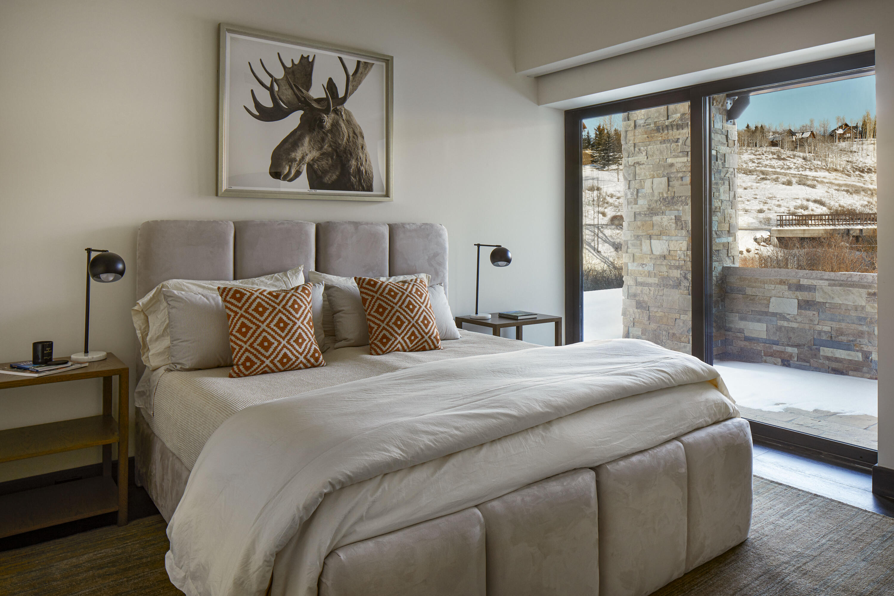 167 Adams Ranch Road Mountain Village, CO 81435 - Photo 17 of 28 a bedroom with a bed and a large window