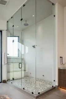 a bedroom with a large bed and a large window