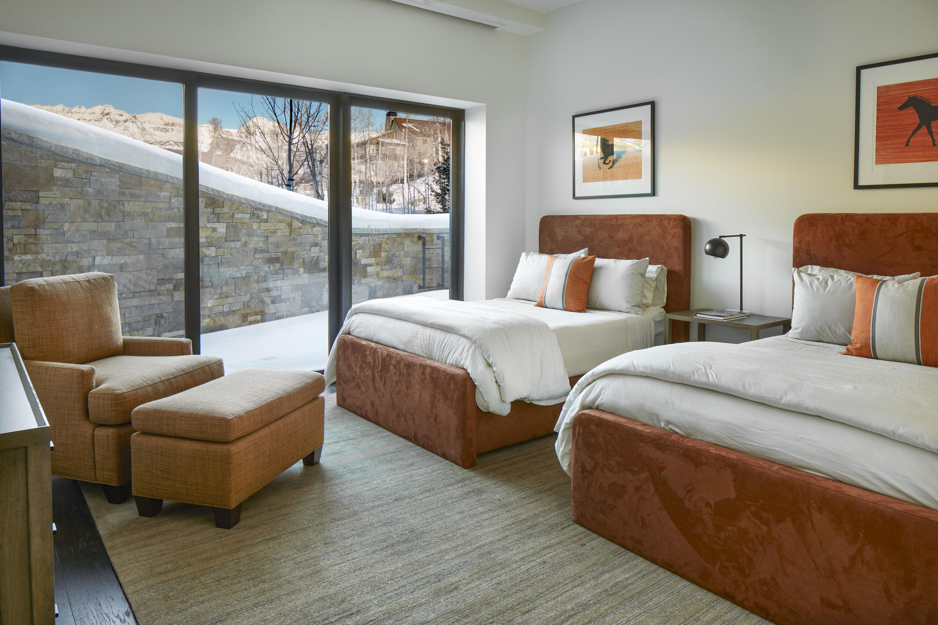 167 Adams Ranch Road Mountain Village, CO 81435 - Photo 21 of 28 a bedroom with two beds and a large window