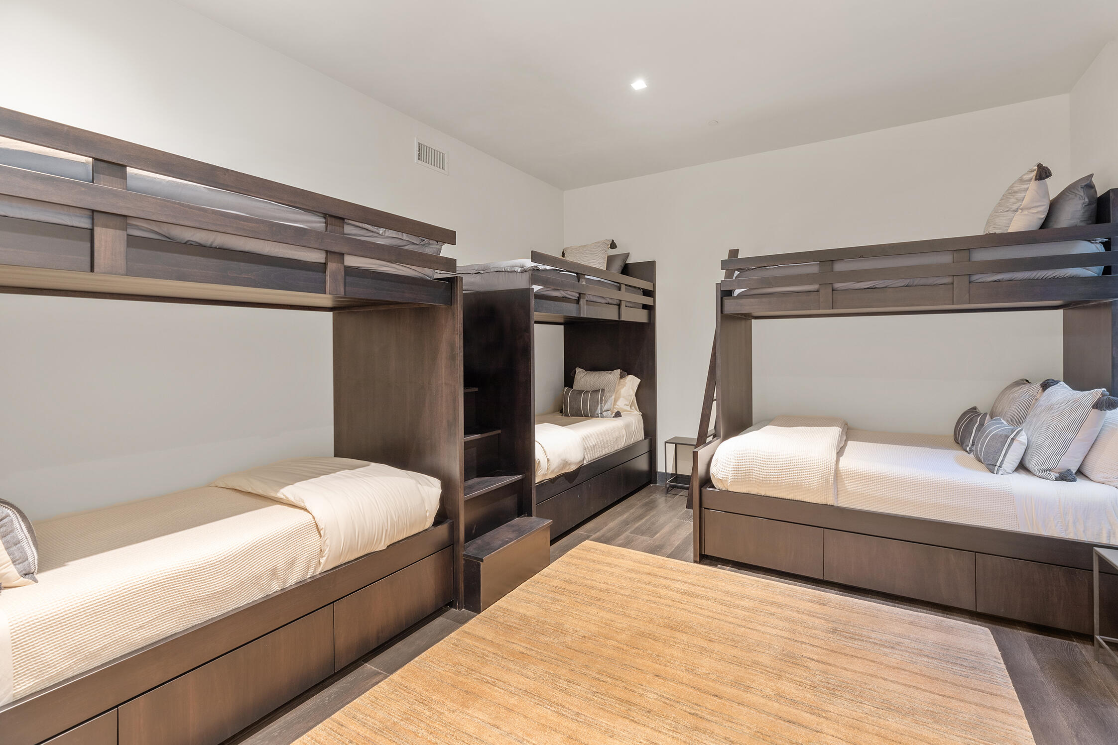 167 Adams Ranch Road Mountain Village, CO 81435 - Photo 23 of 28 a bedroom with a bed and wooden floor