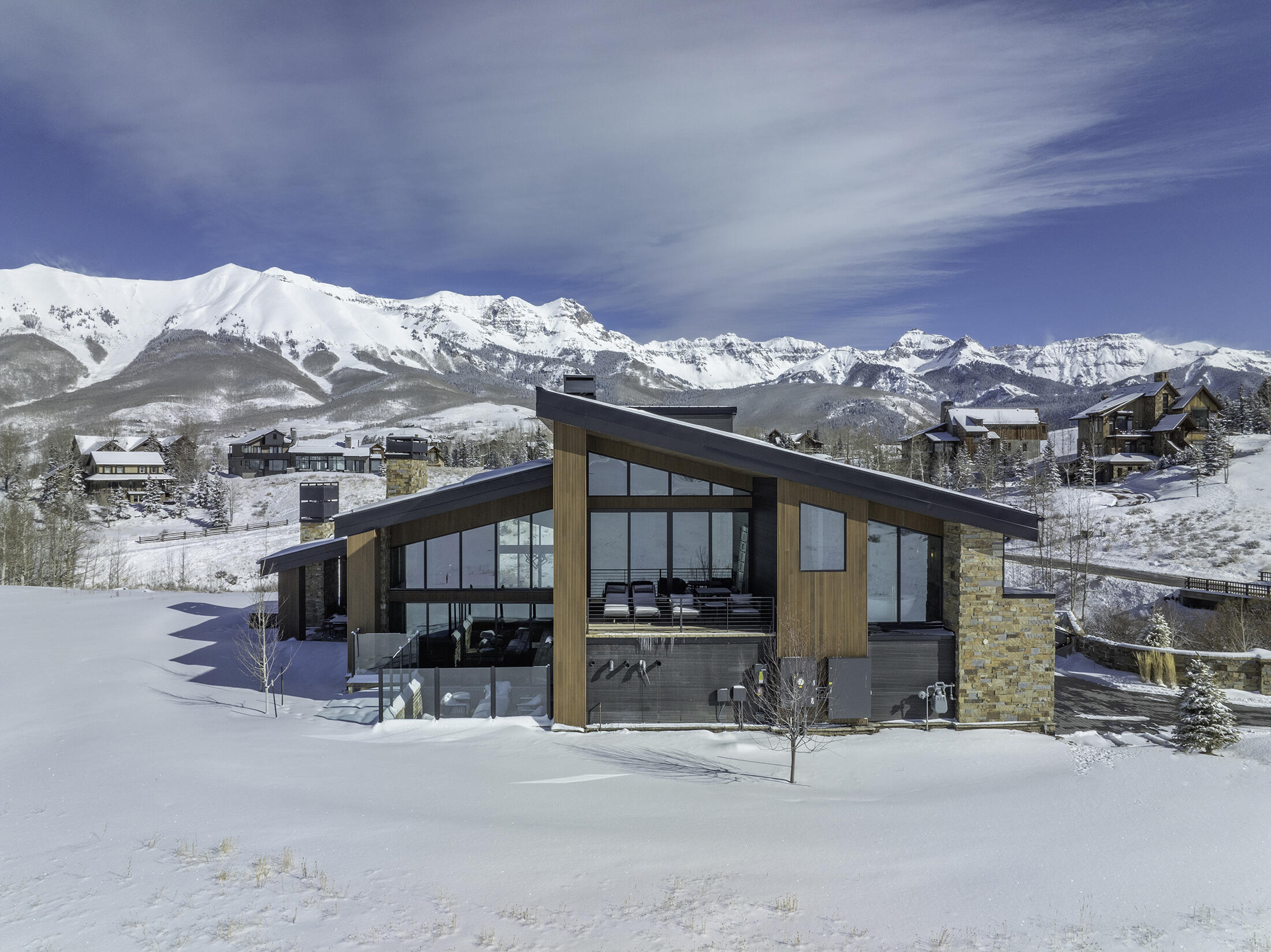 167 Adams Ranch Road Mountain Village, CO 81435 - Photo 25 of 28 a view of a house with furniture and a snow in the background