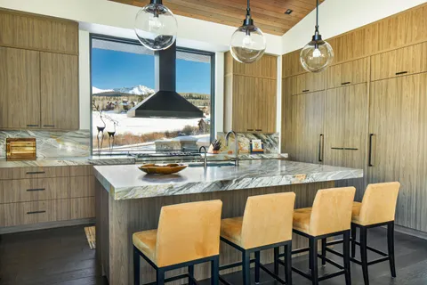a kitchen with a table and chairs in it