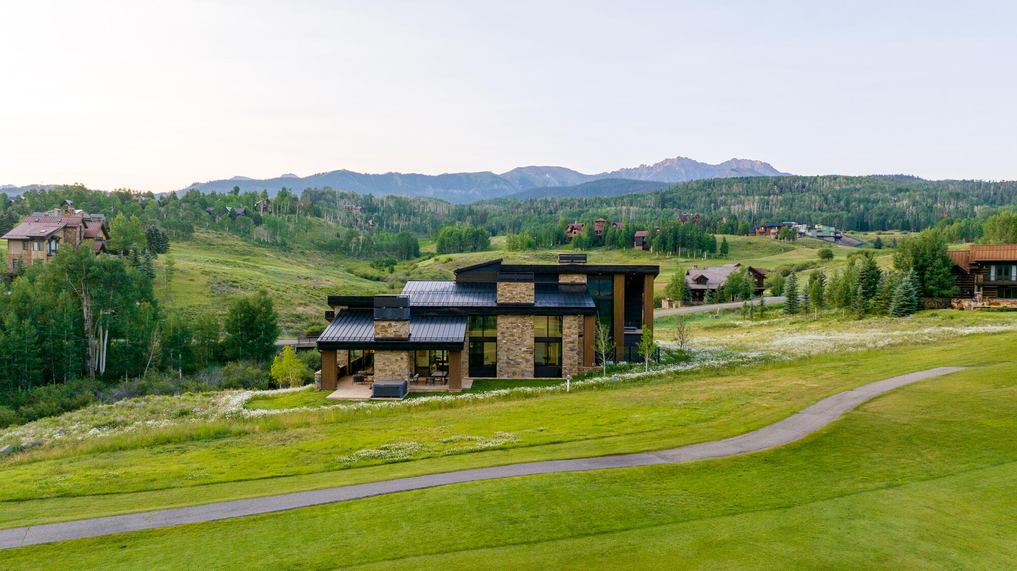 167 Adams Ranch Road Mountain Village, CO 81435 - Photo 8 of 28 a view of a house with a big yard