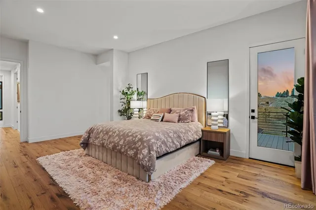 a bedroom with a bed and a table in it