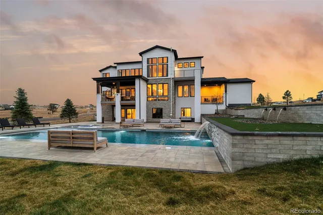 a front view of a house with swimming pool