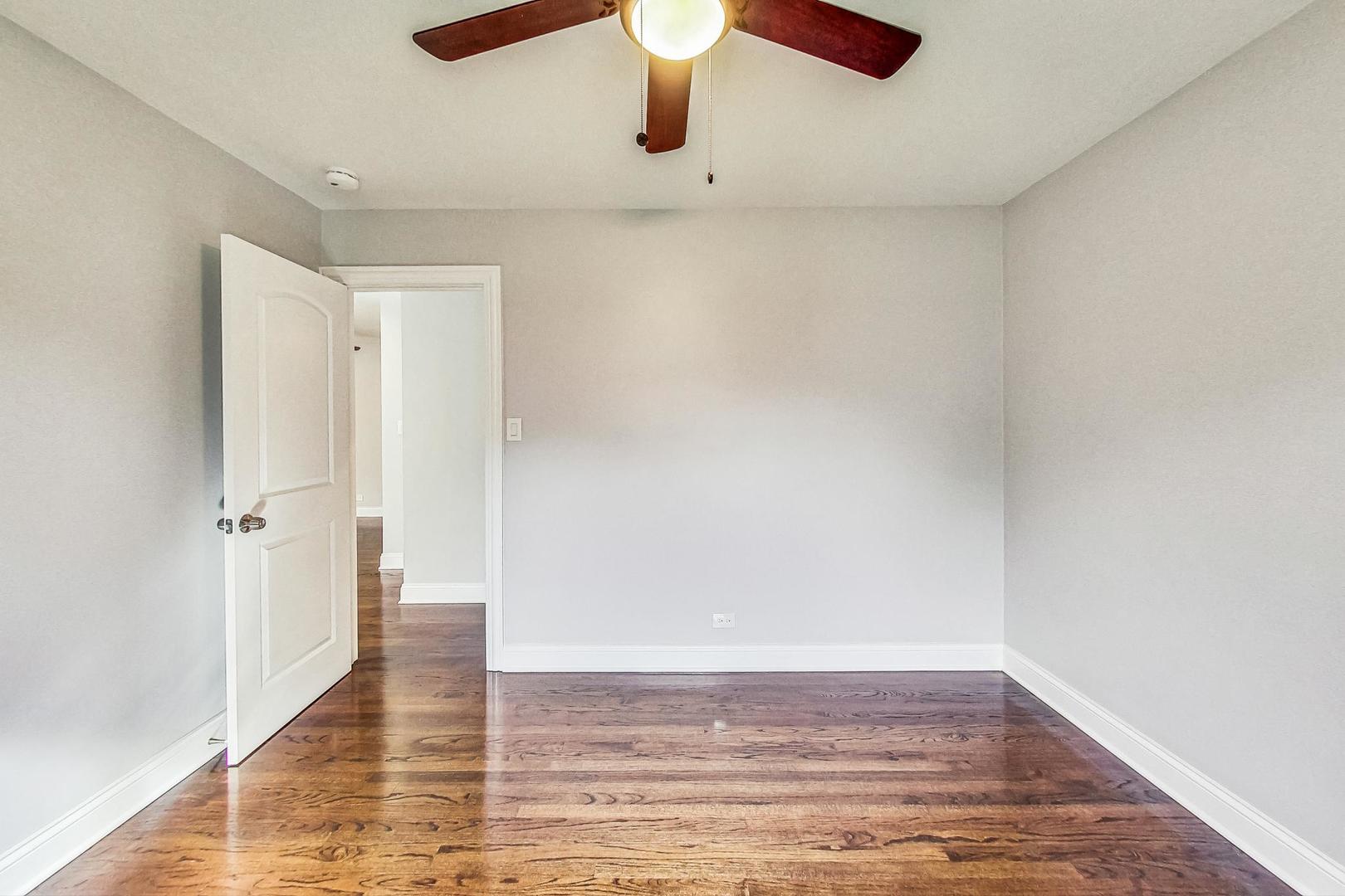111 South We Go Trail Mount Prospect, IL 60056 - Photo 15 of 46 a view of an empty room and wooden floor