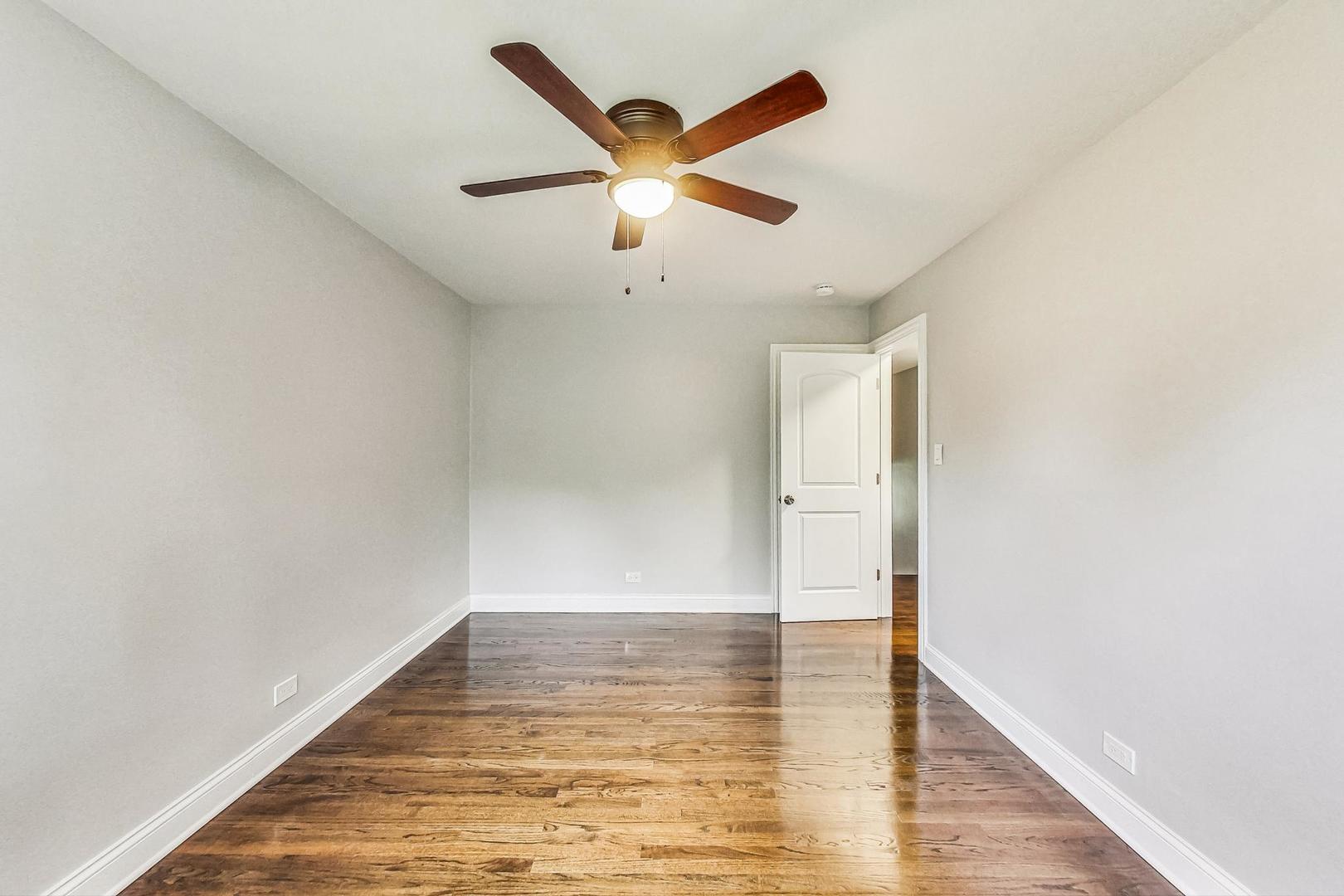 111 South We Go Trail Mount Prospect, IL 60056 - Photo 20 of 46 a view of an empty room with wooden floor