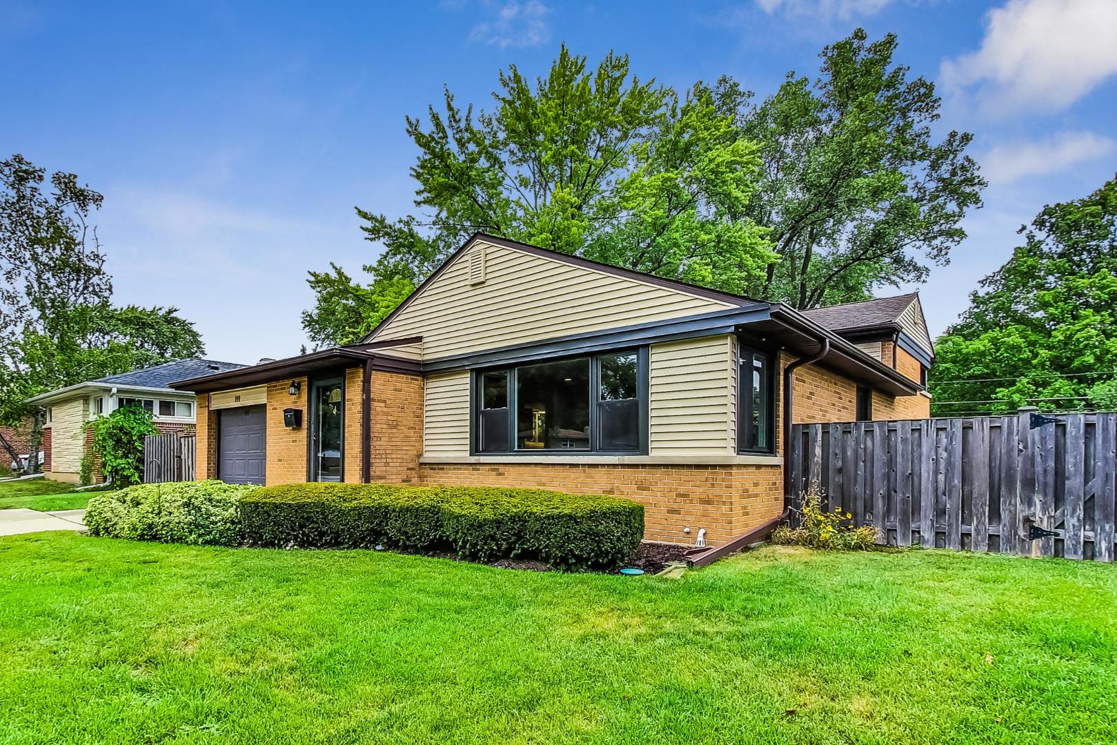 111 South We Go Trail Mount Prospect, IL 60056 - Photo 2 of 46 a view of a house with a yard potted plants and a large tree