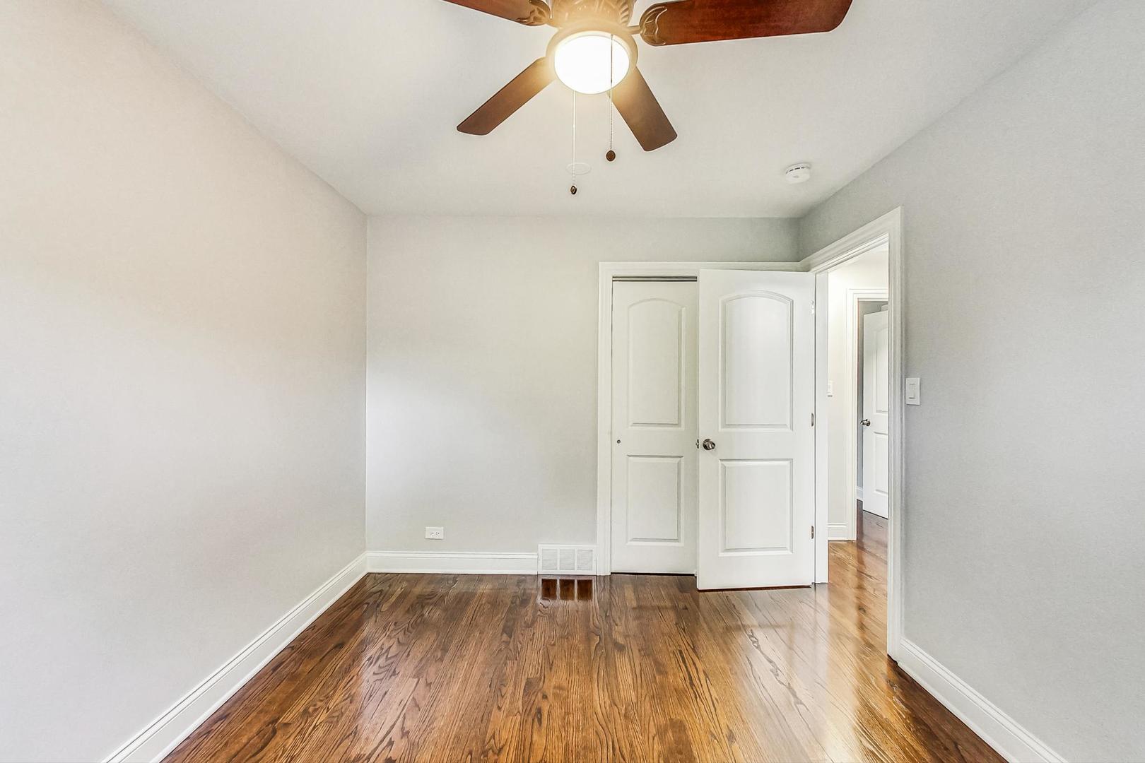 111 South We Go Trail Mount Prospect, IL 60056 - Photo 23 of 46 a view of an empty room with wooden floor