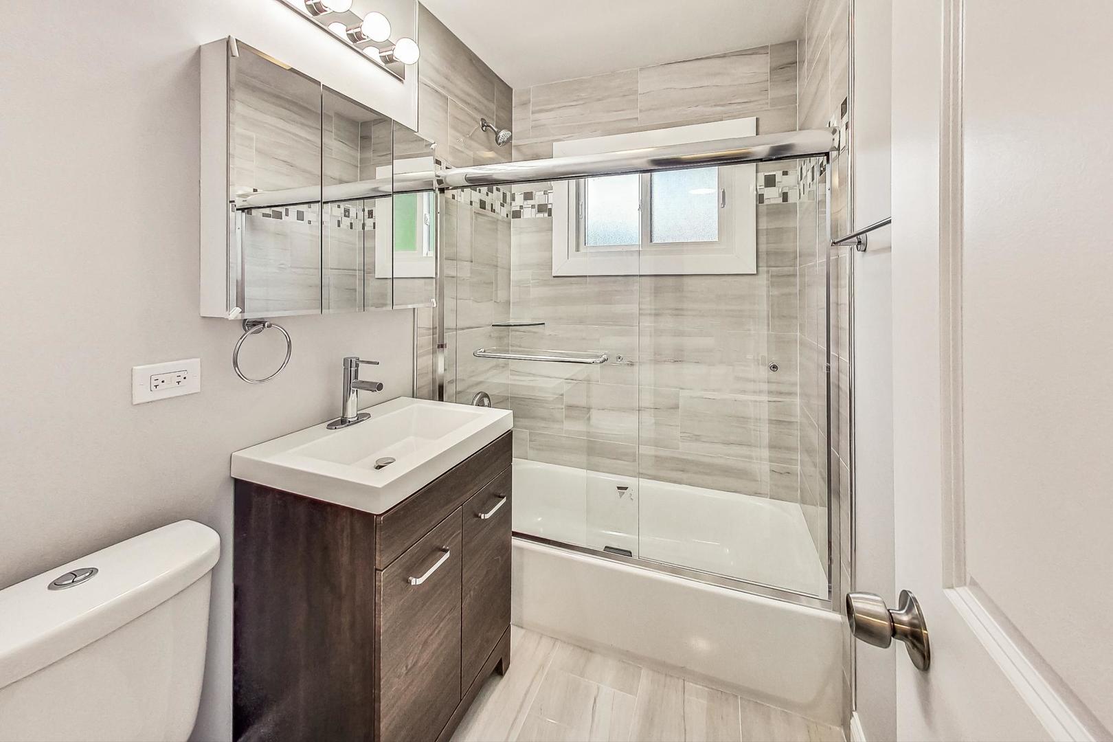 111 South We Go Trail Mount Prospect, IL 60056 - Photo 24 of 46 a bathroom with a sink a toilet and shower