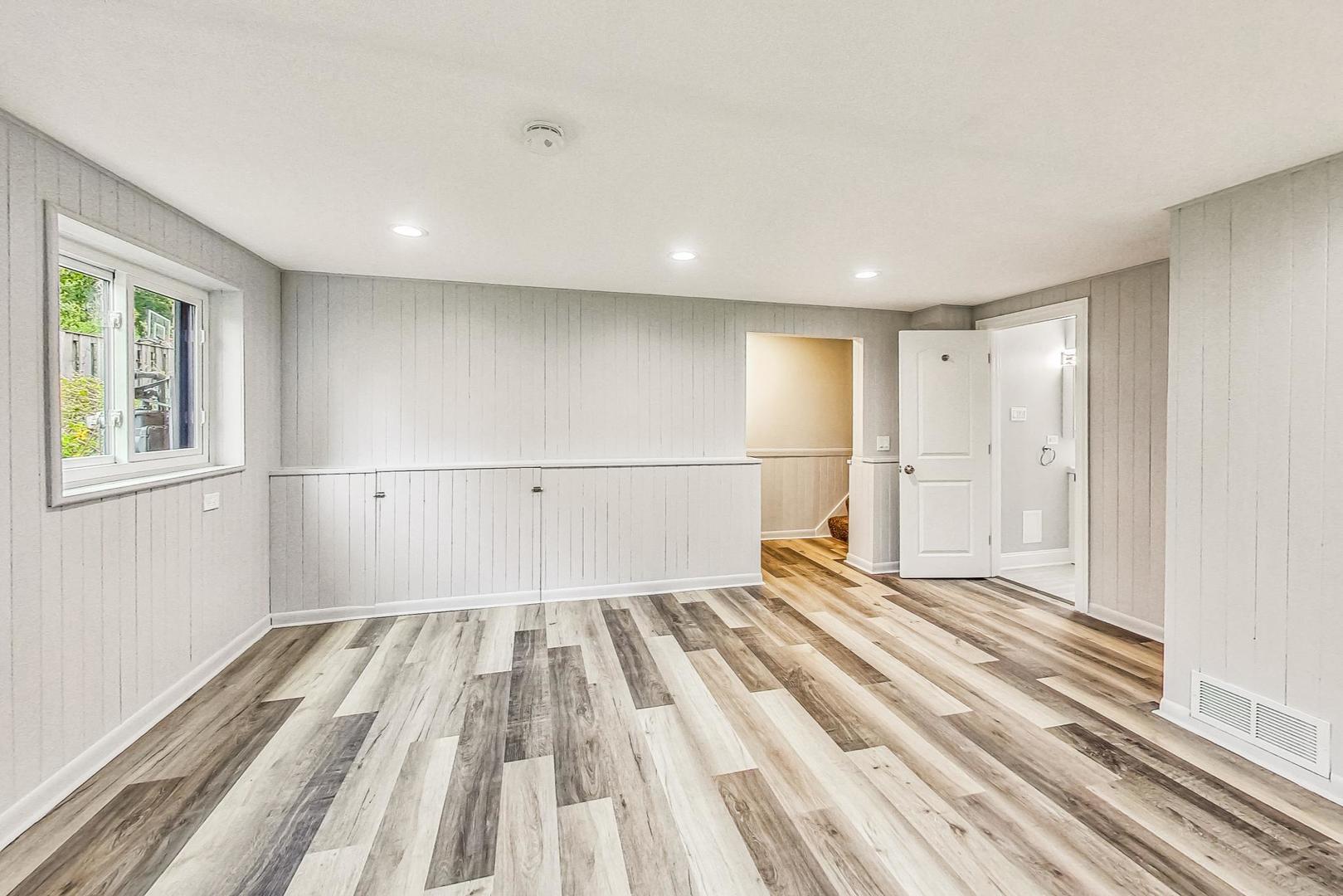 111 South We Go Trail Mount Prospect, IL 60056 - Photo 25 of 46 a view of wooden floor in an empty room with a window