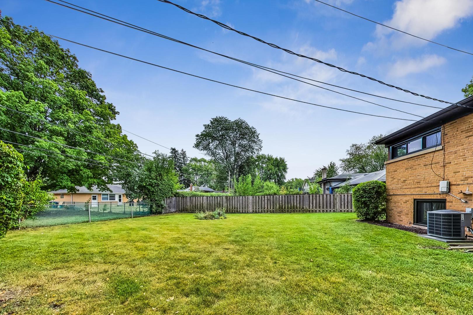111 South We Go Trail Mount Prospect, IL 60056 - Photo 41 of 46 a view of a backyard with a garden