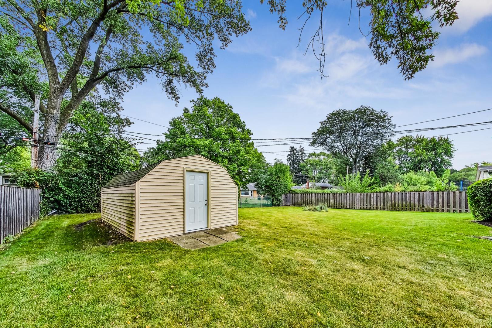 111 South We Go Trail Mount Prospect, IL 60056 - Photo 42 of 46 a view of a backyard with a garden and entertaining space