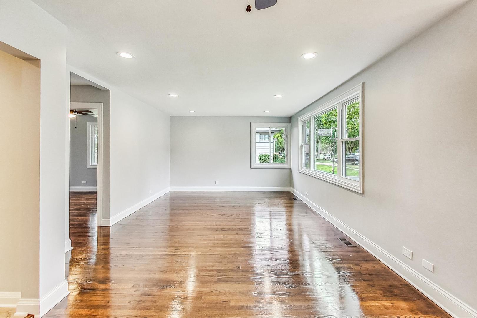 111 South We Go Trail Mount Prospect, IL 60056 - Photo 6 of 46 a view of an empty room with wooden floor and a window