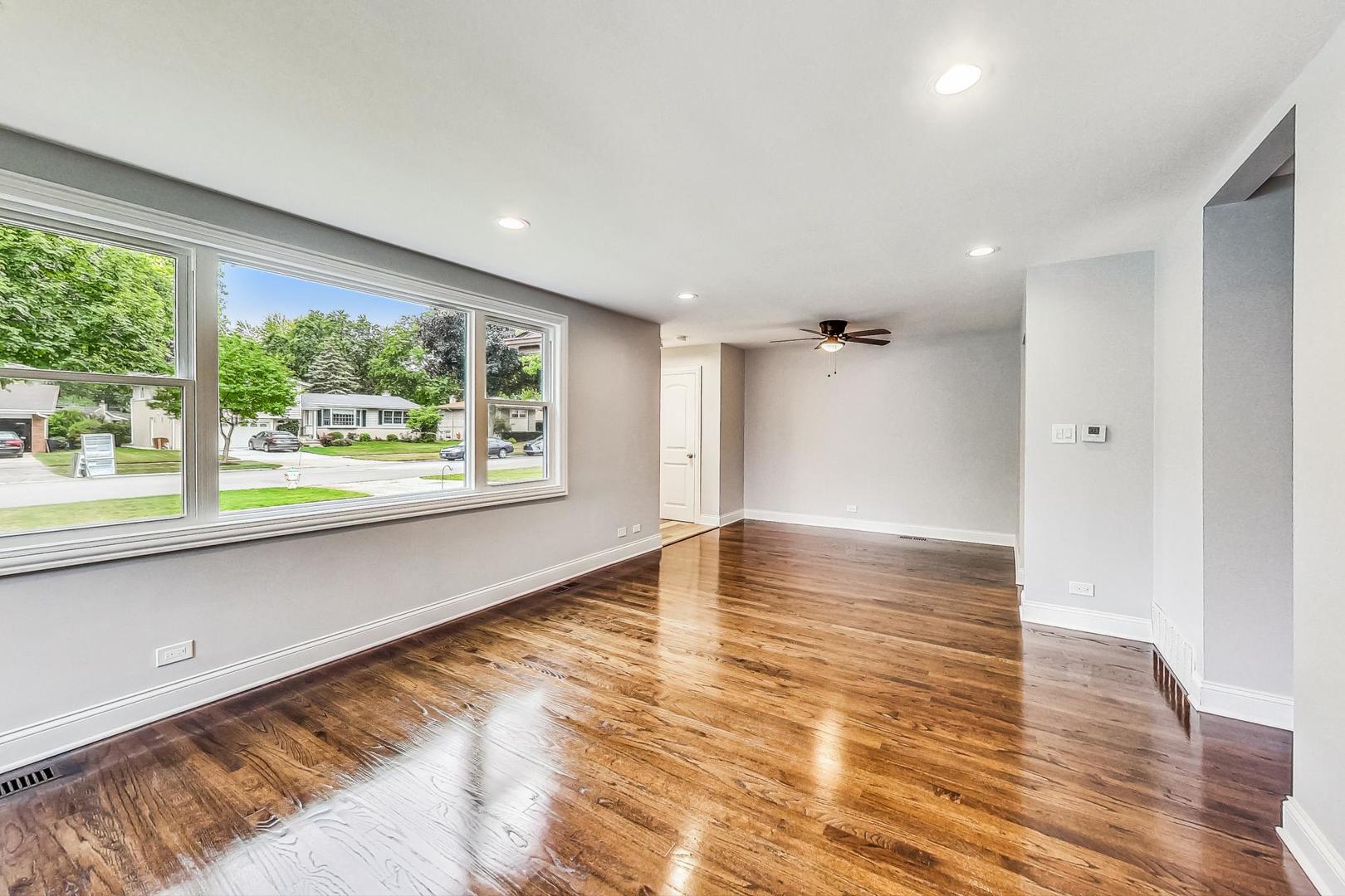 111 South We Go Trail Mount Prospect, IL 60056 - Photo 8 of 46 an empty room with wooden floor and windows