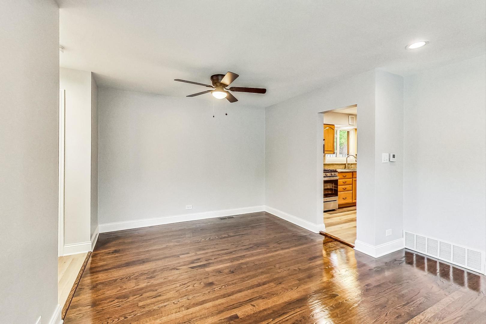 111 South We Go Trail Mount Prospect, IL 60056 - Photo 9 of 46 a view of a room with wooden floor and ceiling fan