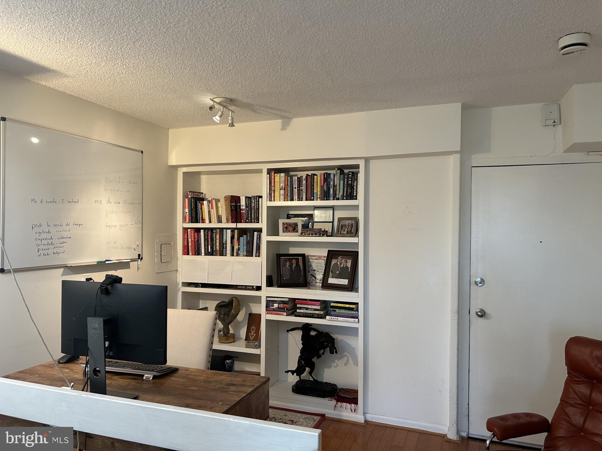 1800 R Street Northwest, Unit 808 Washington, DC 20009 - Photo 8 of 10 a view of a workspace with furniture and wooden floor