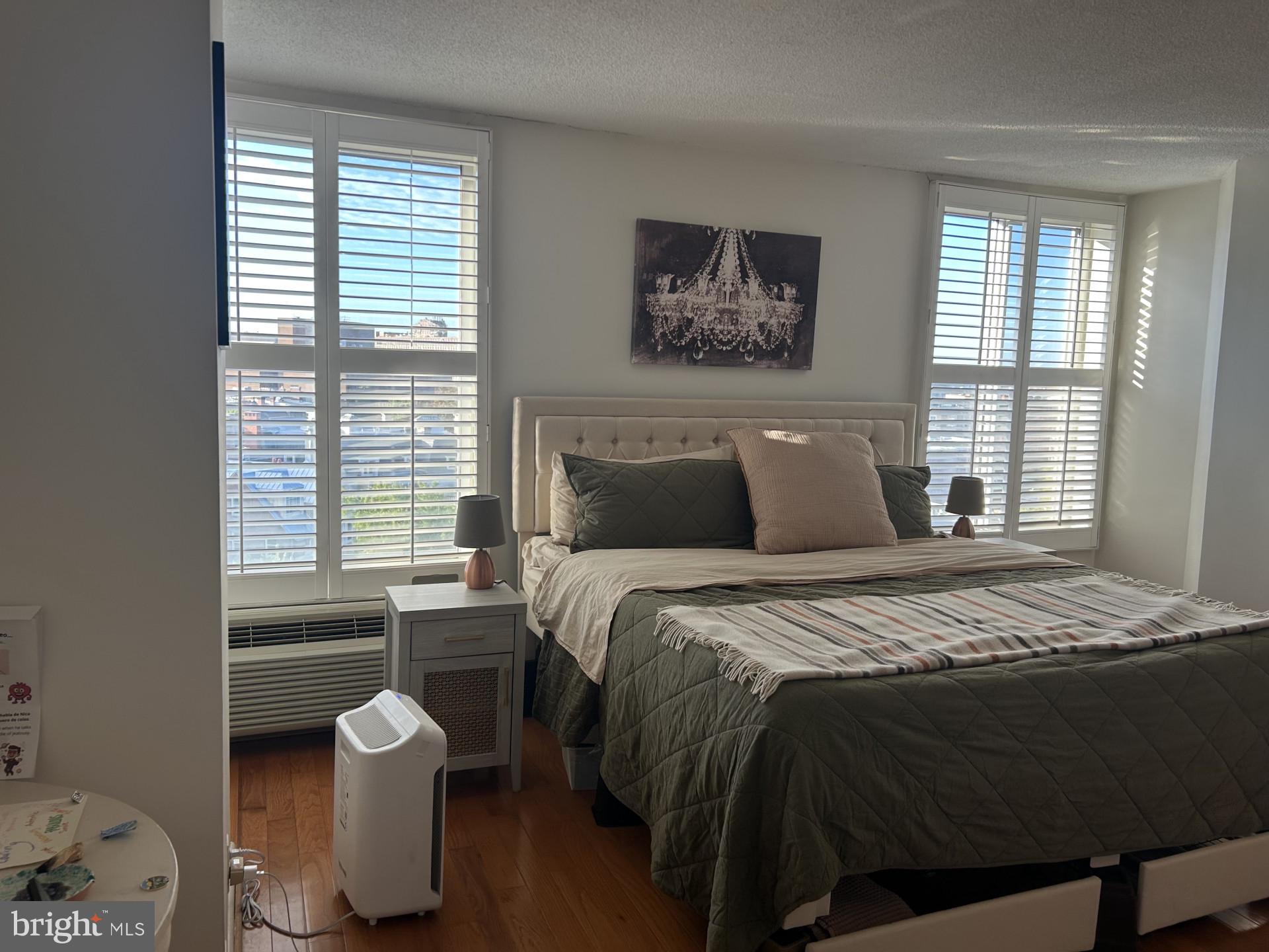 1800 R Street Northwest, Unit 808 Washington, DC 20009 - Photo 9 of 10 a bedroom with a bed and a window