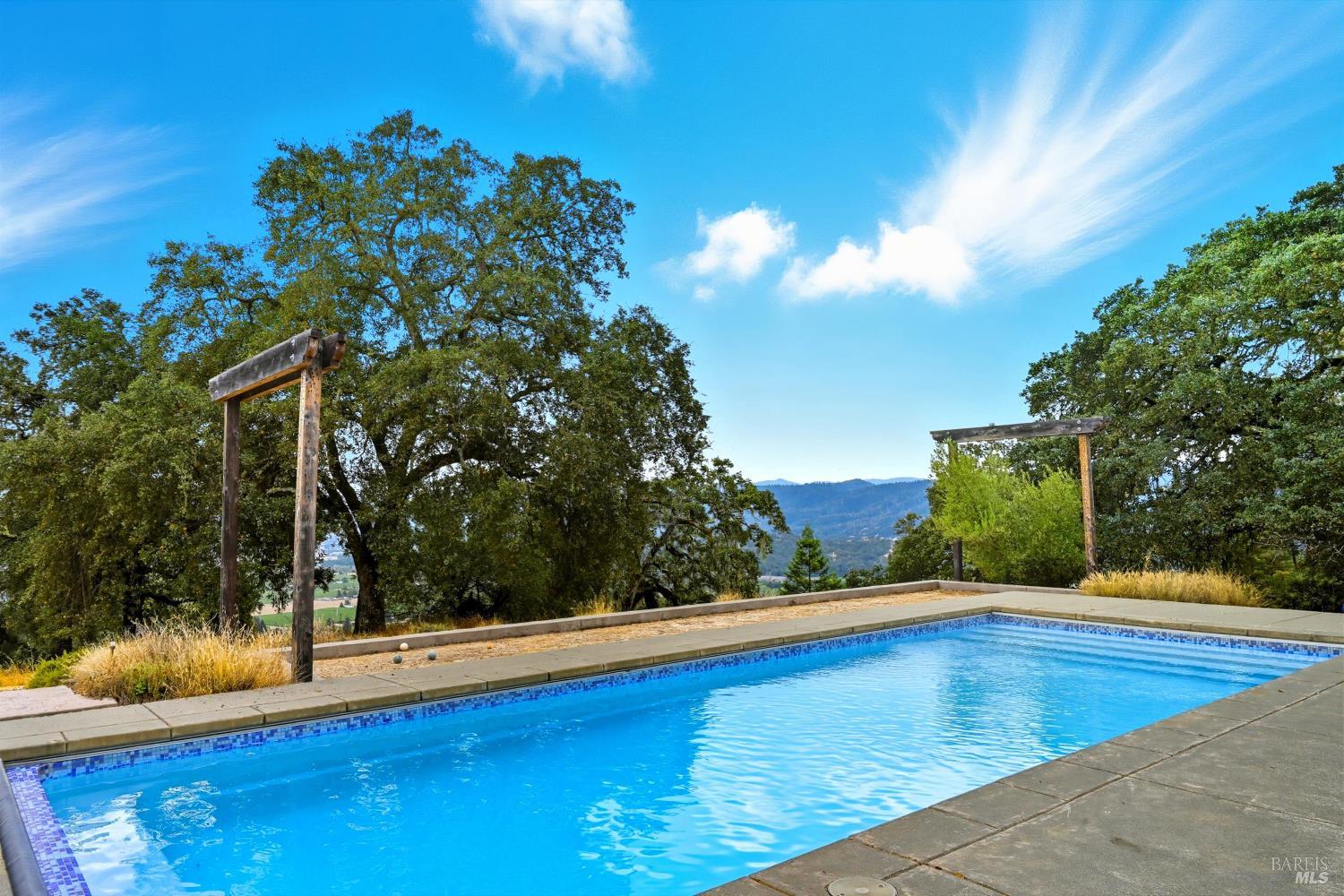 31000 Pine Mountain Road Cloverdale, CA 95425 - Photo 46 of 61 The pool terrace captures sweeping mountain views in a serene setting designed for relaxation and entertaining.