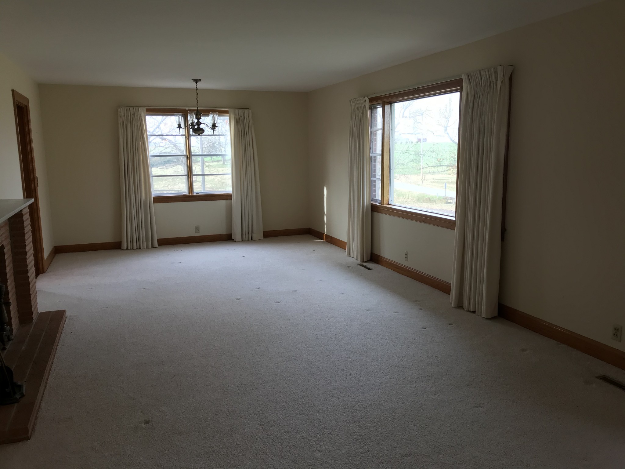 7129 Highland Road Portland, TN 37148 - Photo 11 of 35 an empty room with chandelier fan and windows