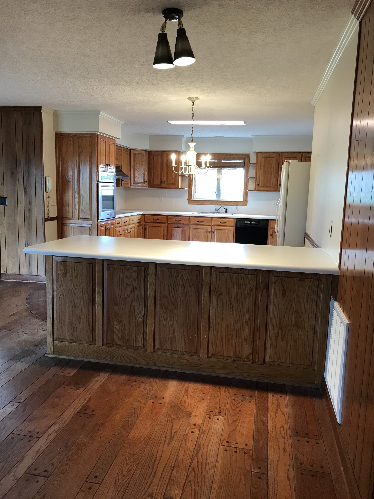 7129 Highland Road Portland, TN 37148 - Photo 15 of 35 a kitchen with stainless steel appliances granite countertop wooden cabinets a sink and dishwasher