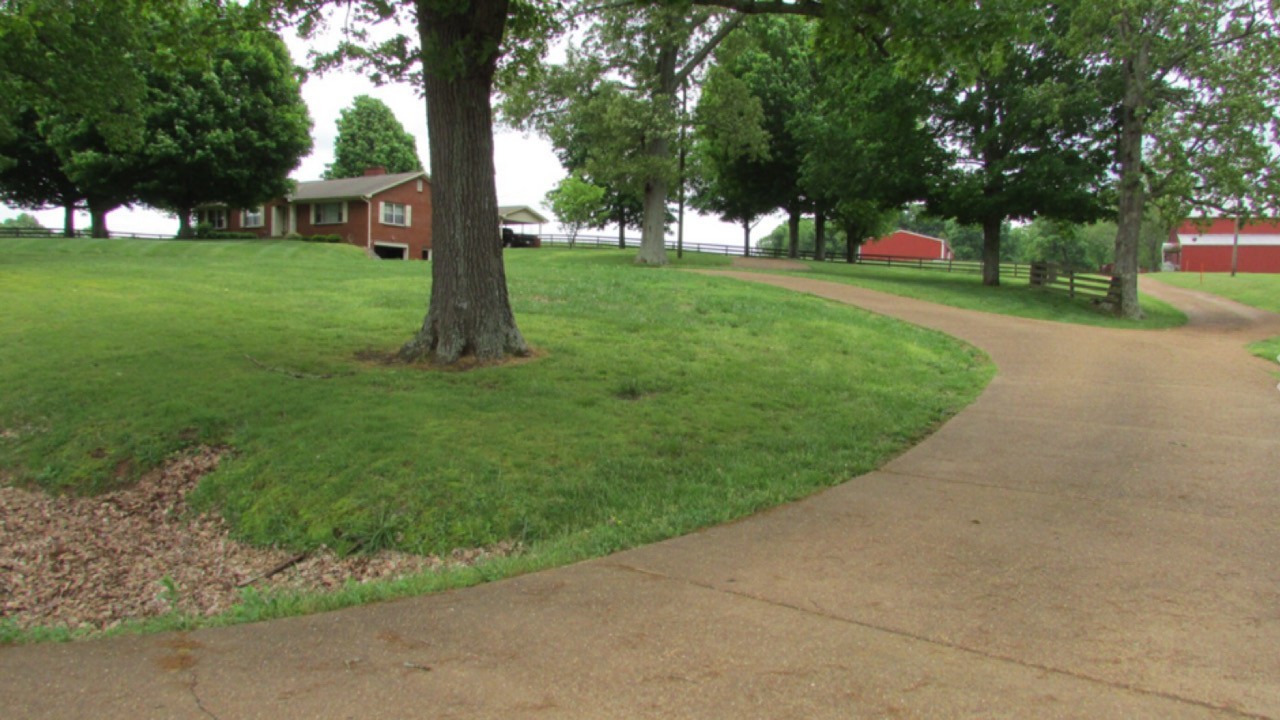 7129 Highland Road Portland, TN 37148 - Photo 3 of 35 a view of a park with large trees