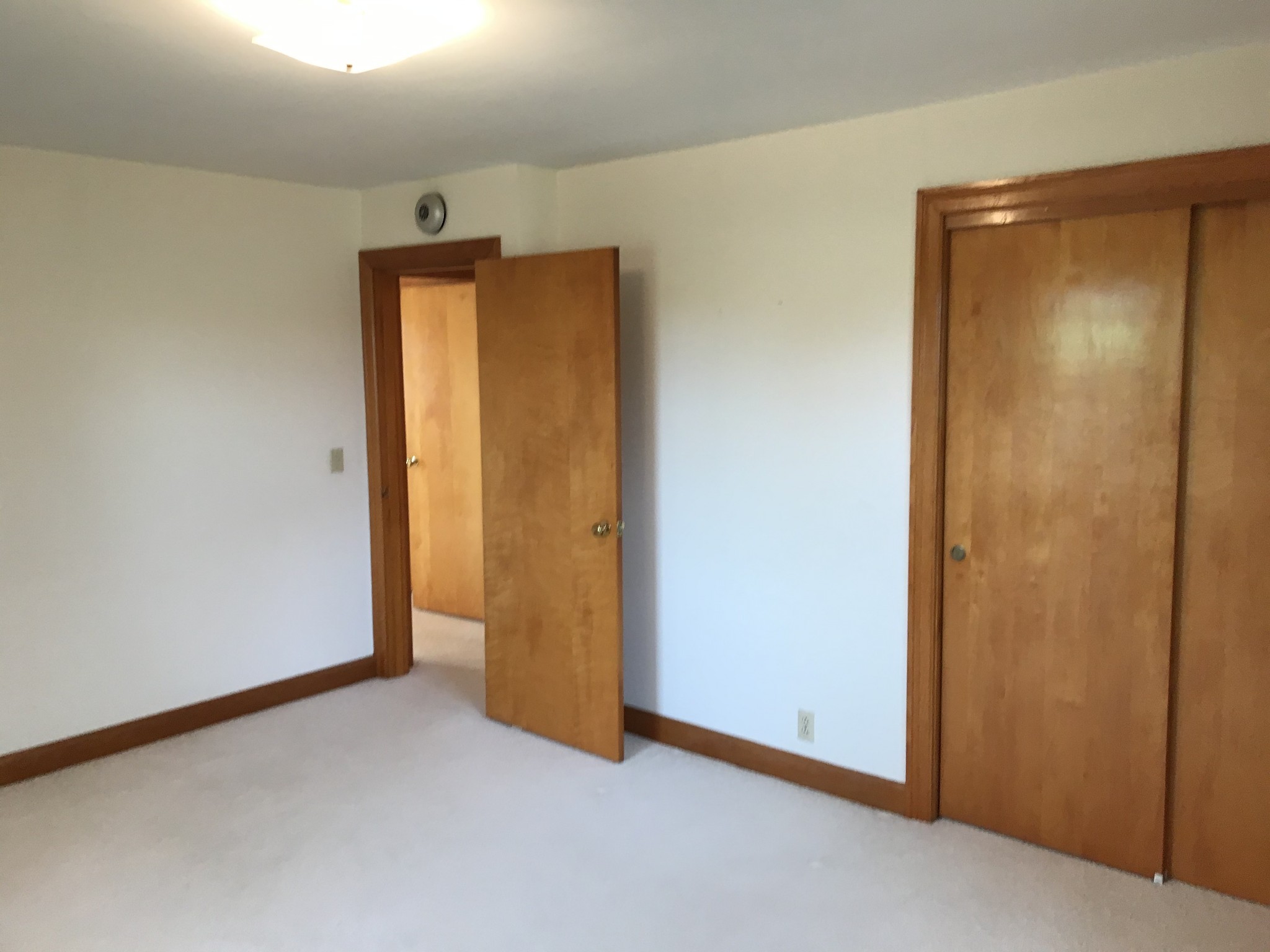 7129 Highland Road Portland, TN 37148 - Photo 21 of 35 an empty room with closet and wooden door