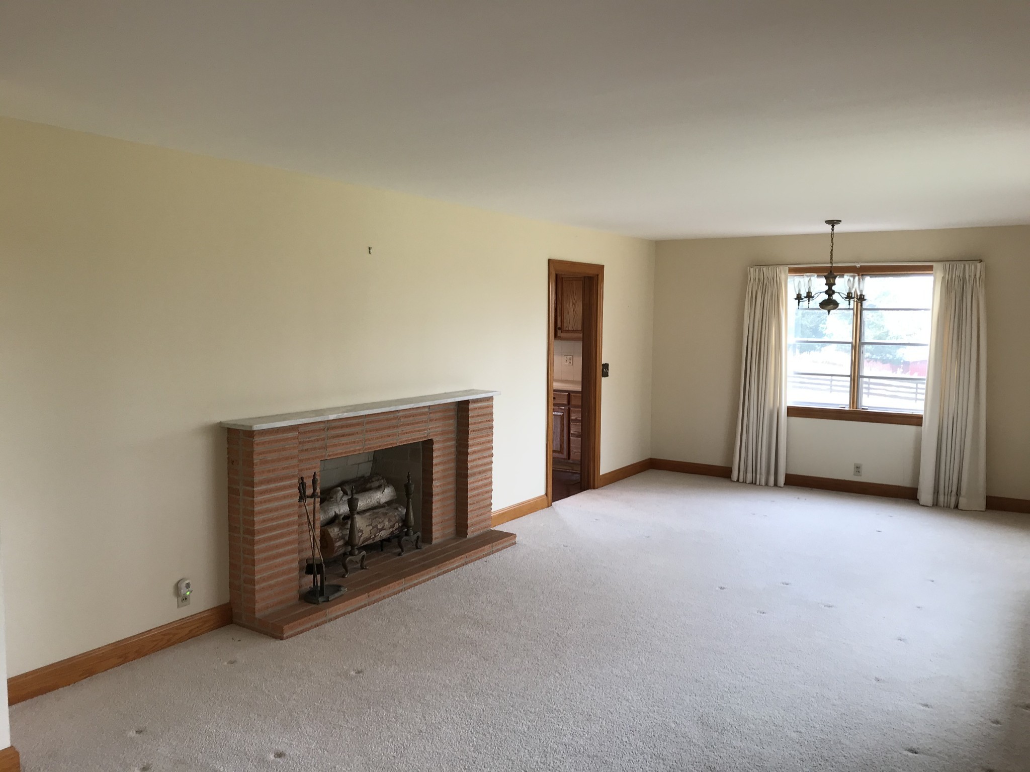 7129 Highland Road Portland, TN 37148 - Photo 9 of 35 an empty room with fireplace and windows
