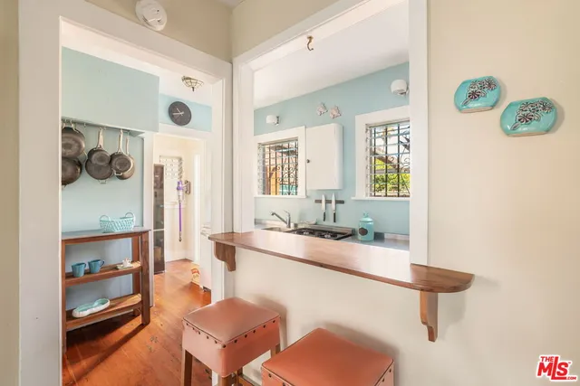 a dining room with furniture and a window