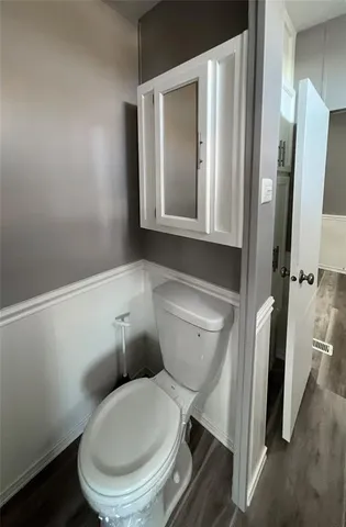 a bathroom with a toilet and a sink