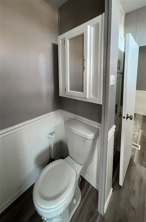 6501 Southeast 55th Lane, Unit 6501 Okeechobee, FL 34974 - Photo 14 of 15 a bathroom with a toilet and a sink