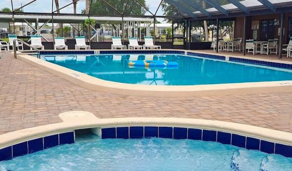 6501 Southeast 55th Lane, Unit 6501 Okeechobee, FL 34974 - Photo 15 of 15 a view of swimming pool with outdoor seating