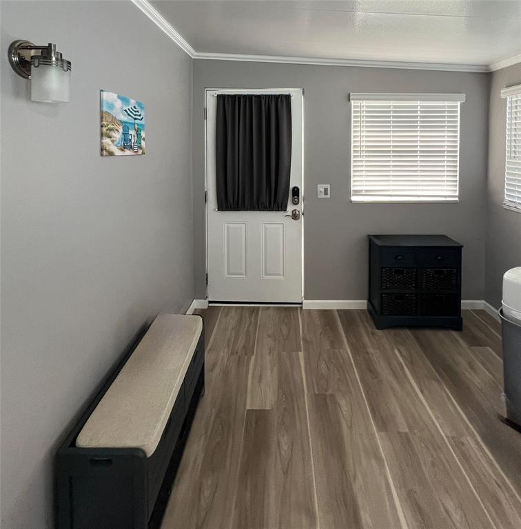 6501 Southeast 55th Lane, Unit 6501 Okeechobee, FL 34974 - Photo 3 of 15 a view of bedroom with a bed and a window